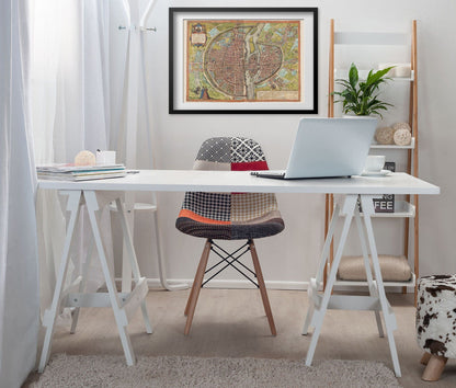 Paris 1572 Map print framed above a white desk in a home office