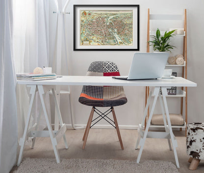 Paris 1615 Map print framed above a white desk in a home office
