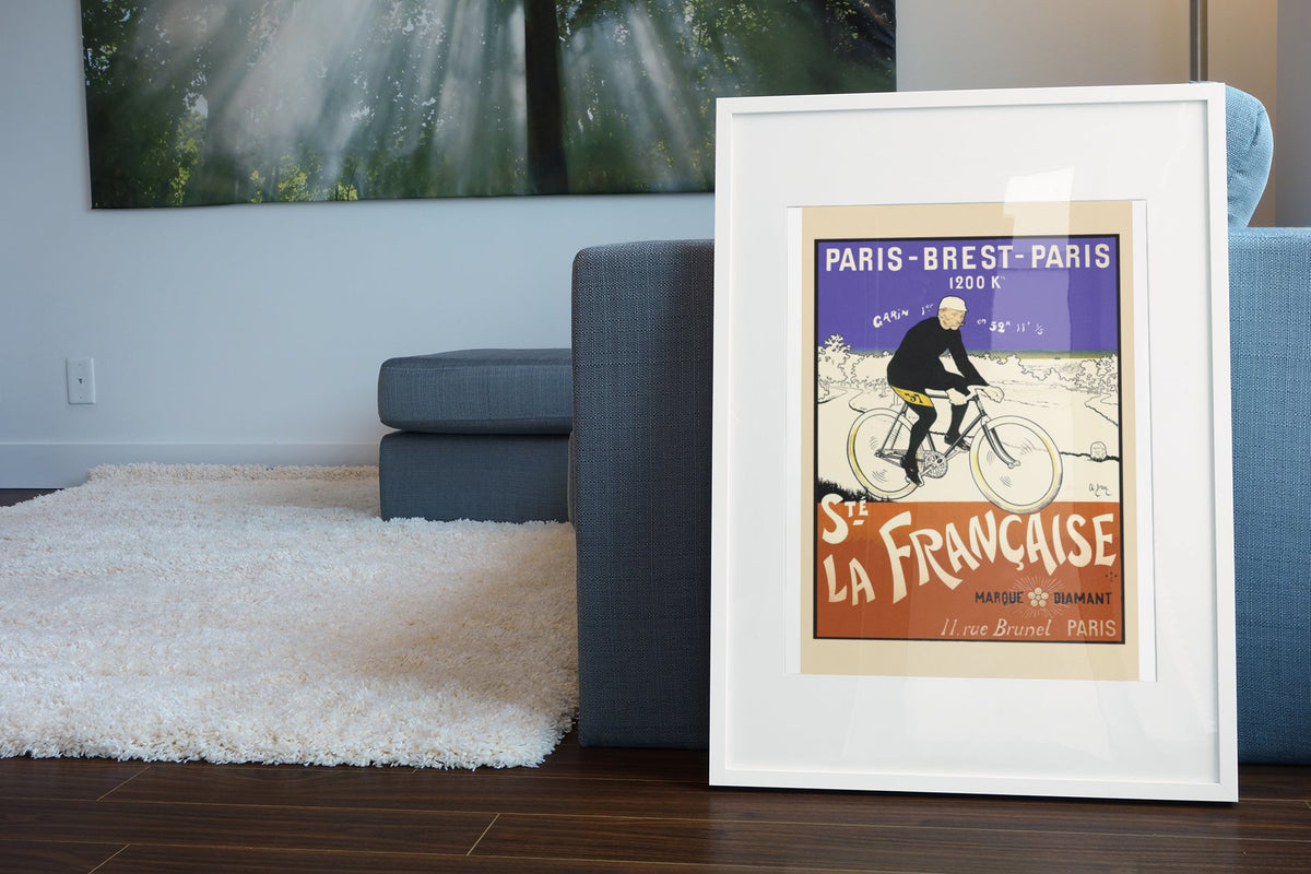 Paris-Brest-Paris La Francaise poster leaning beside a blue sofa