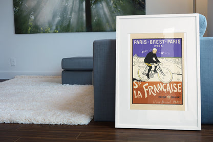 Paris-Brest-Paris La Francaise poster leaning beside a blue sofa