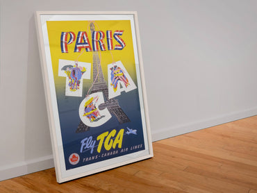 Paris Fly TCA poster in a white frame leaning against a wall