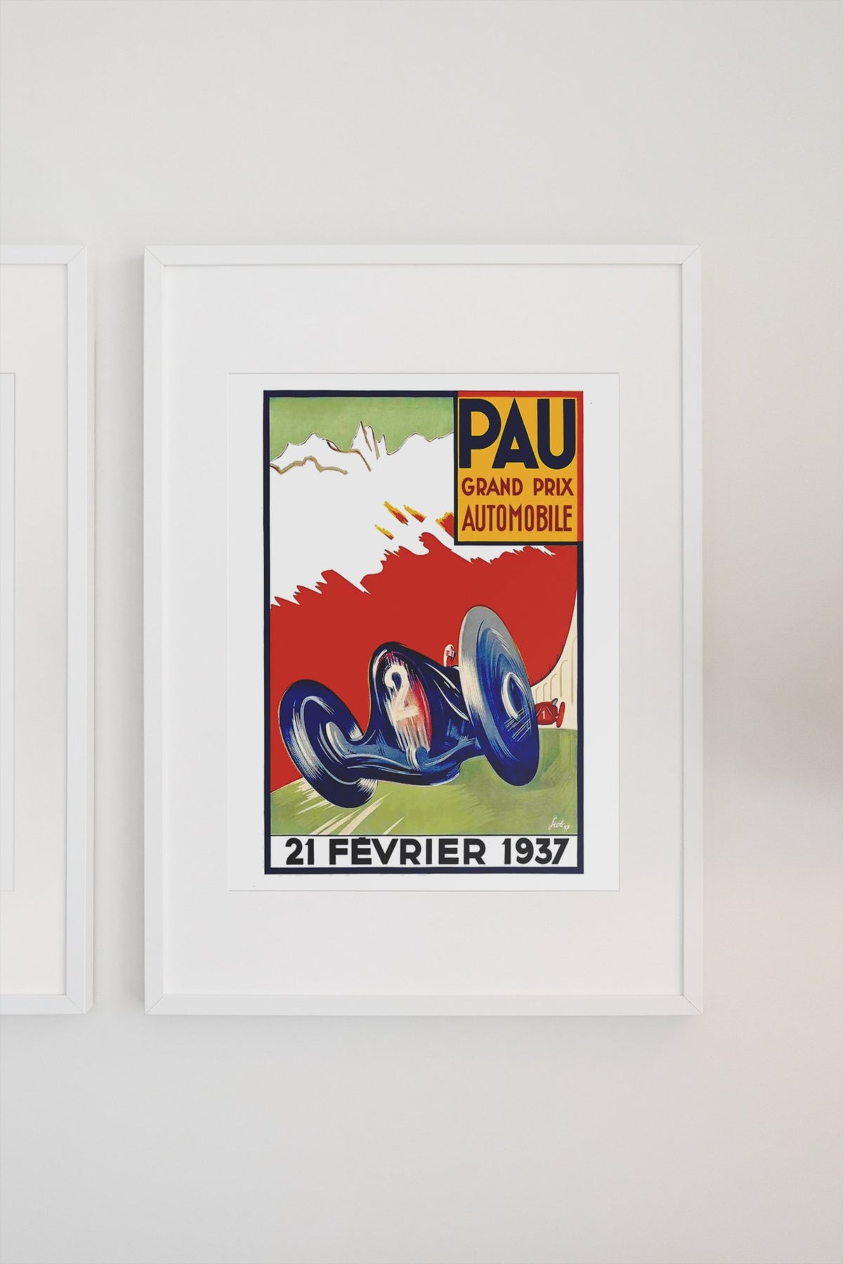 Pau Grand Prix 1937 poster in a white frame on a light wall