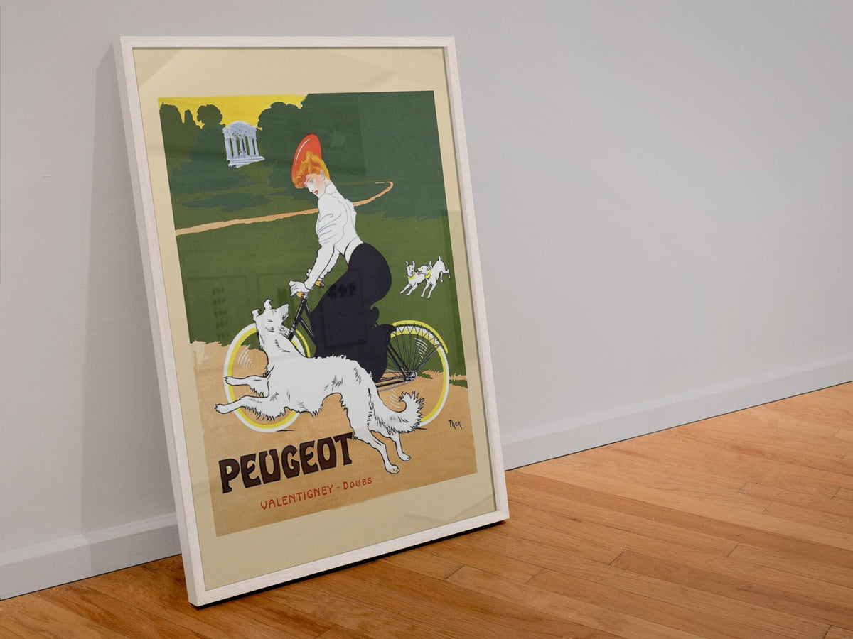 Peugeot Bicycles poster in a white frame leaning against a wall