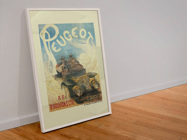Peugeot poster in a white frame leaning against a wall