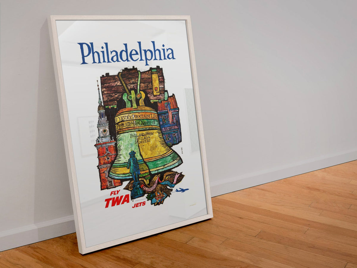Philadelphia Fly TWA poster in a white frame leaning against a wall