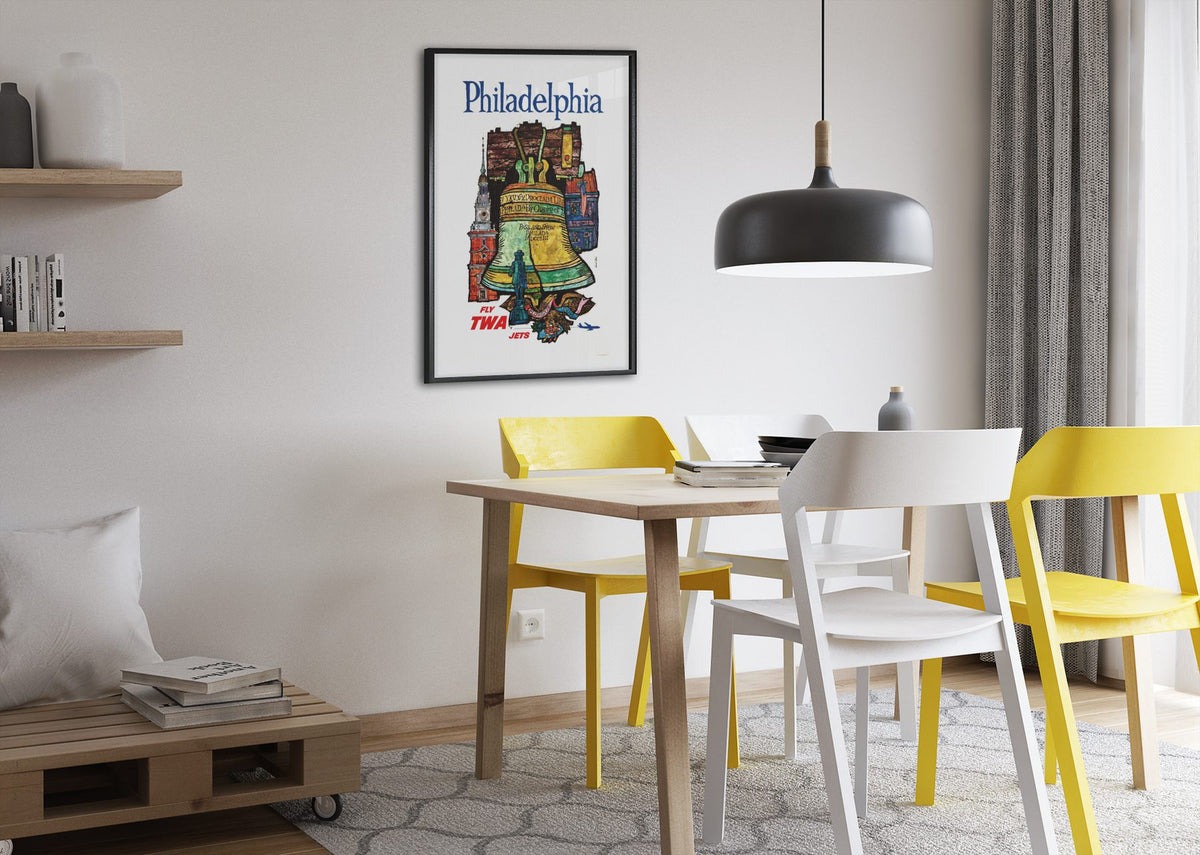 Philadelphia Fly TWA poster framed above a dining table