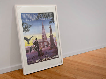 Philadelphia Go Greyhound poster in a white frame leaning against a wall