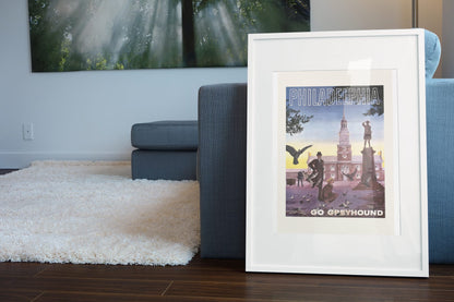 Philadelphia Go Greyhound poster leaning beside a blue sofa