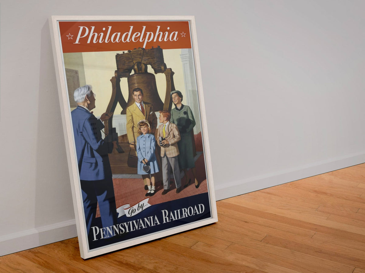 Philadelphia Pennsylvania Railroad poster in a white frame leaning against a wall