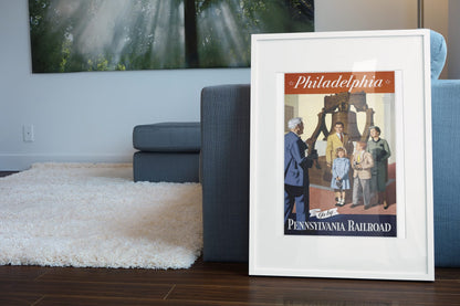 Philadelphia Pennsylvania Railroad poster leaning beside a blue sofa