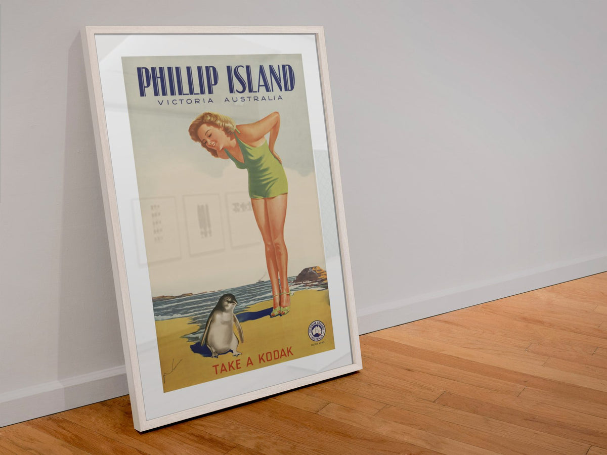 Phillip Island — Take a Kodak poster in a white frame leaning against a wall