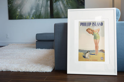 Phillip Island — Take a Kodak poster leaning beside a blue sofa