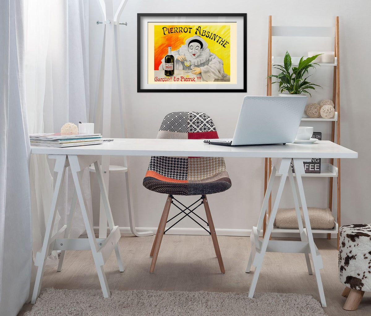 Pierrot Absinthe poster framed above a white desk in a home office