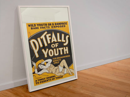 Pitfalls of Youth poster in a white frame leaning against a wall