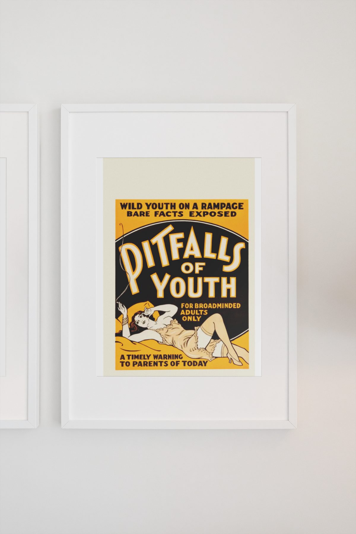 Pitfalls of Youth poster on a light wall