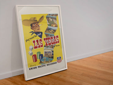 Play Round the Clock Las Vegas poster in a white frame leaning against a wall