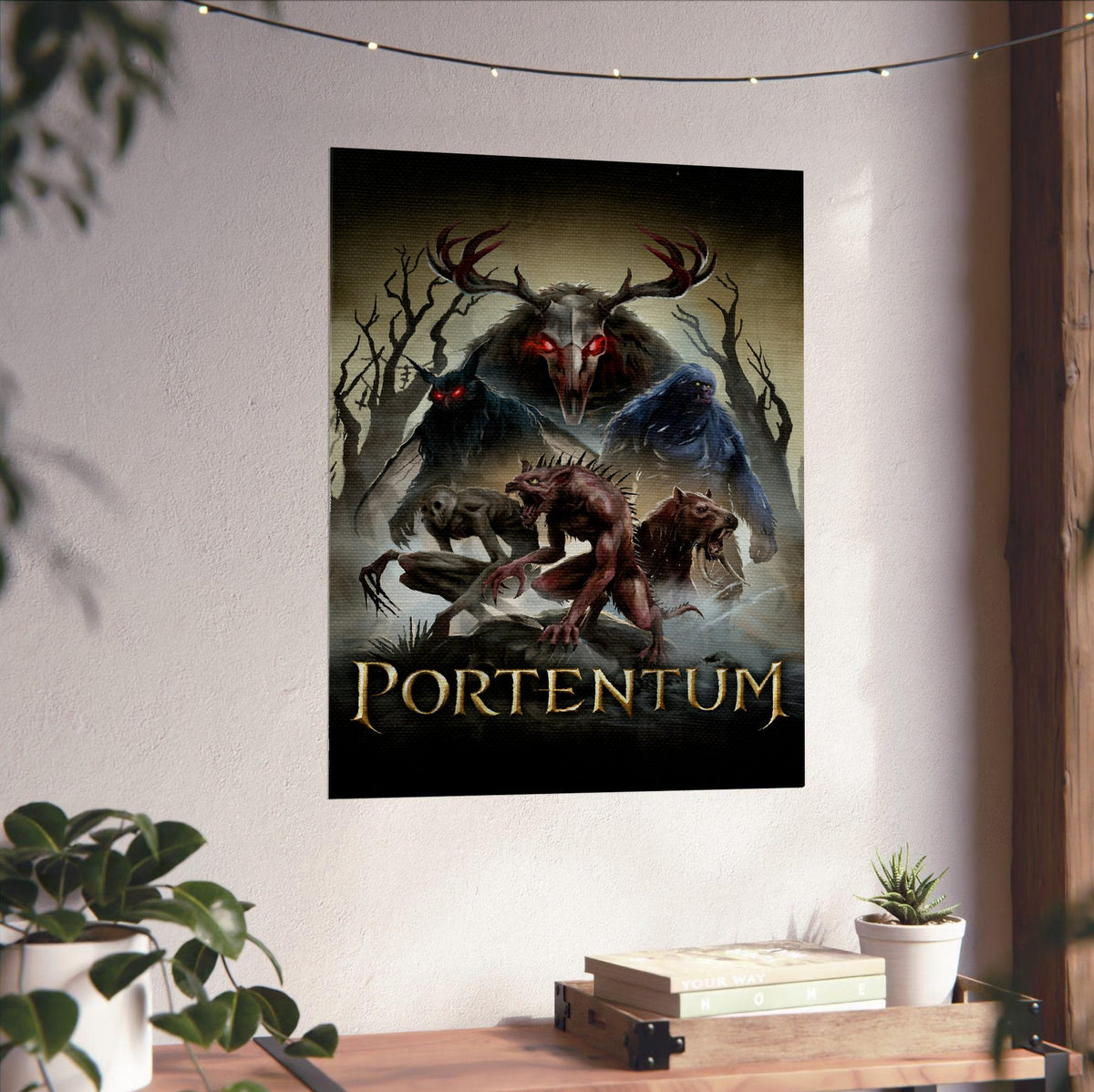 Portentum Box Art poster unframed on a white wall above a desk