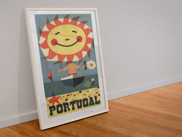Portugal Smiling Sun poster in a white frame leaning against a wall