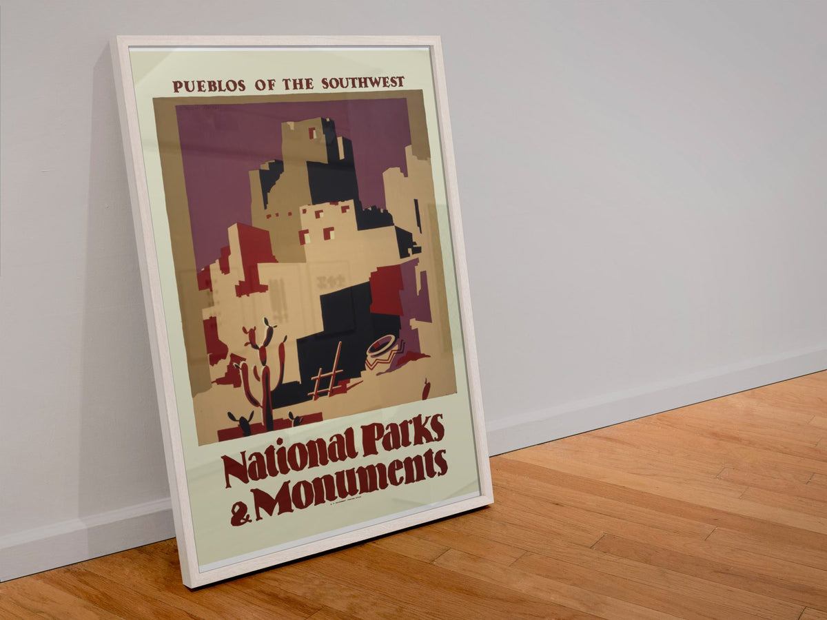Pueblos of the Southwest National Parks poster in a white frame leaning against a wall