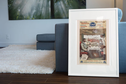 Pullman Dining Car — CH&D Railroad poster leaning beside a blue sofa