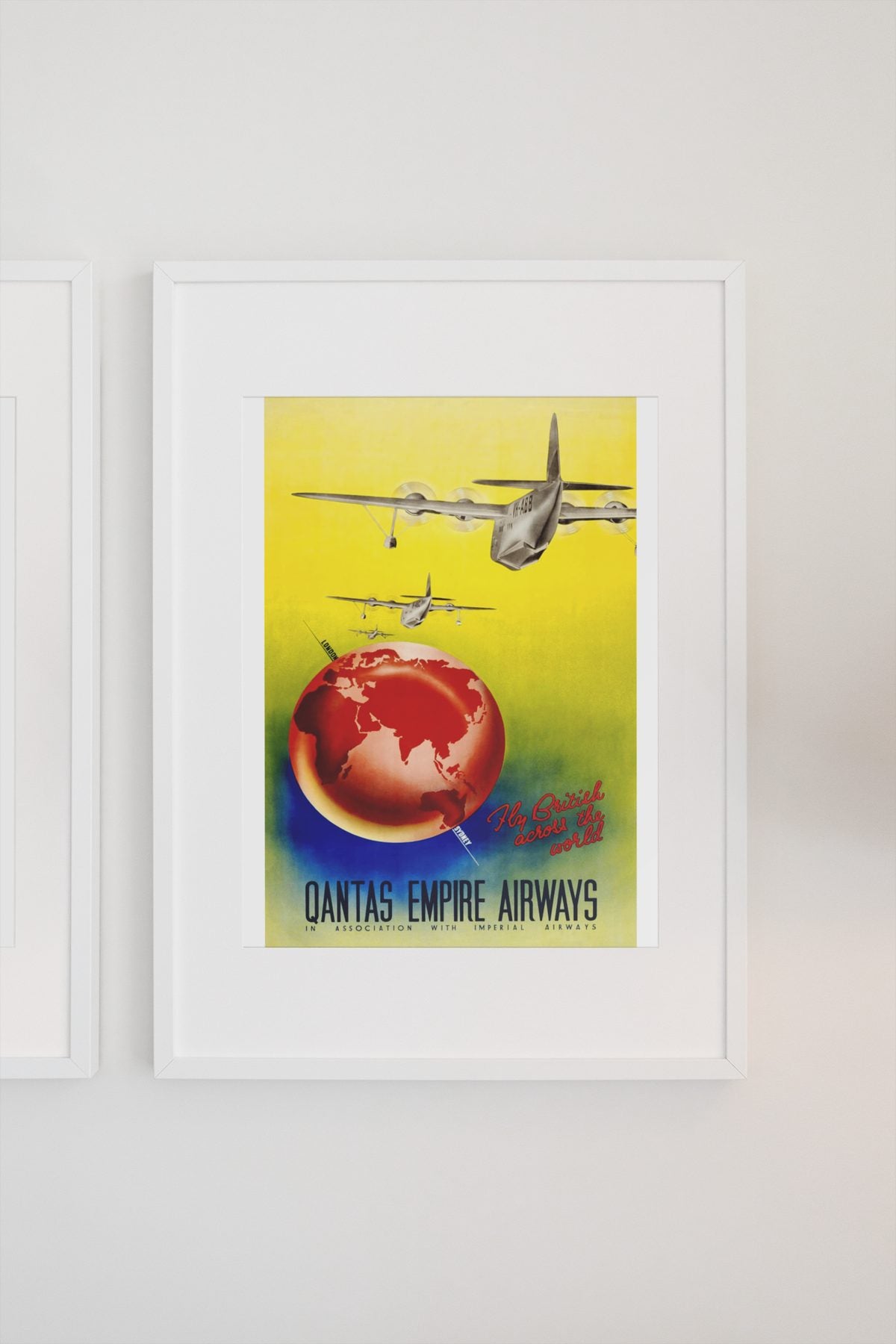 Qantas Empire Airways poster on a light wall