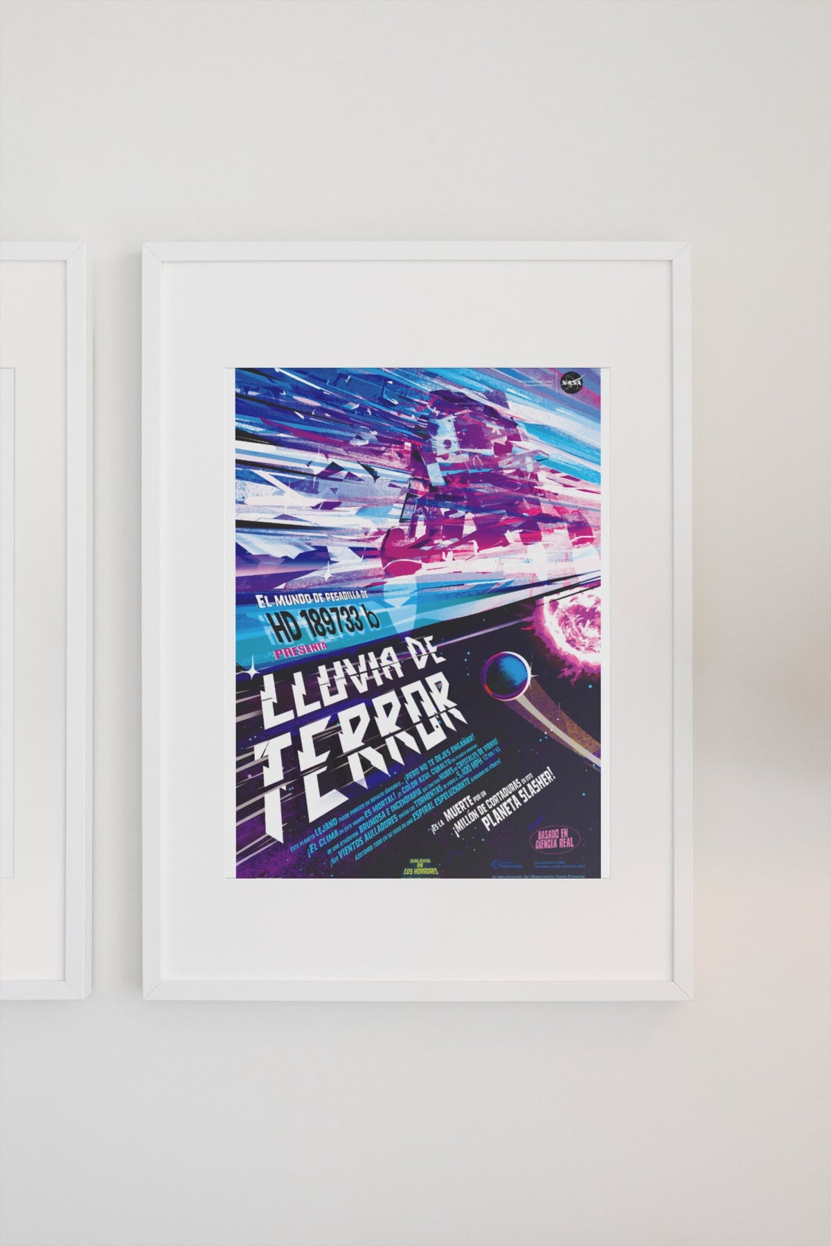 Rains of Terror, Lluvia de Terror Spanish edition poster in a white frame on a light wall