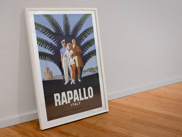 Rapallo Italy poster in a white frame leaning against a wall