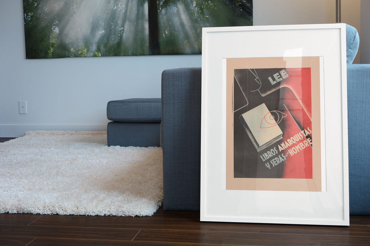 Read Anarchist Books poster leaning beside a blue sofa