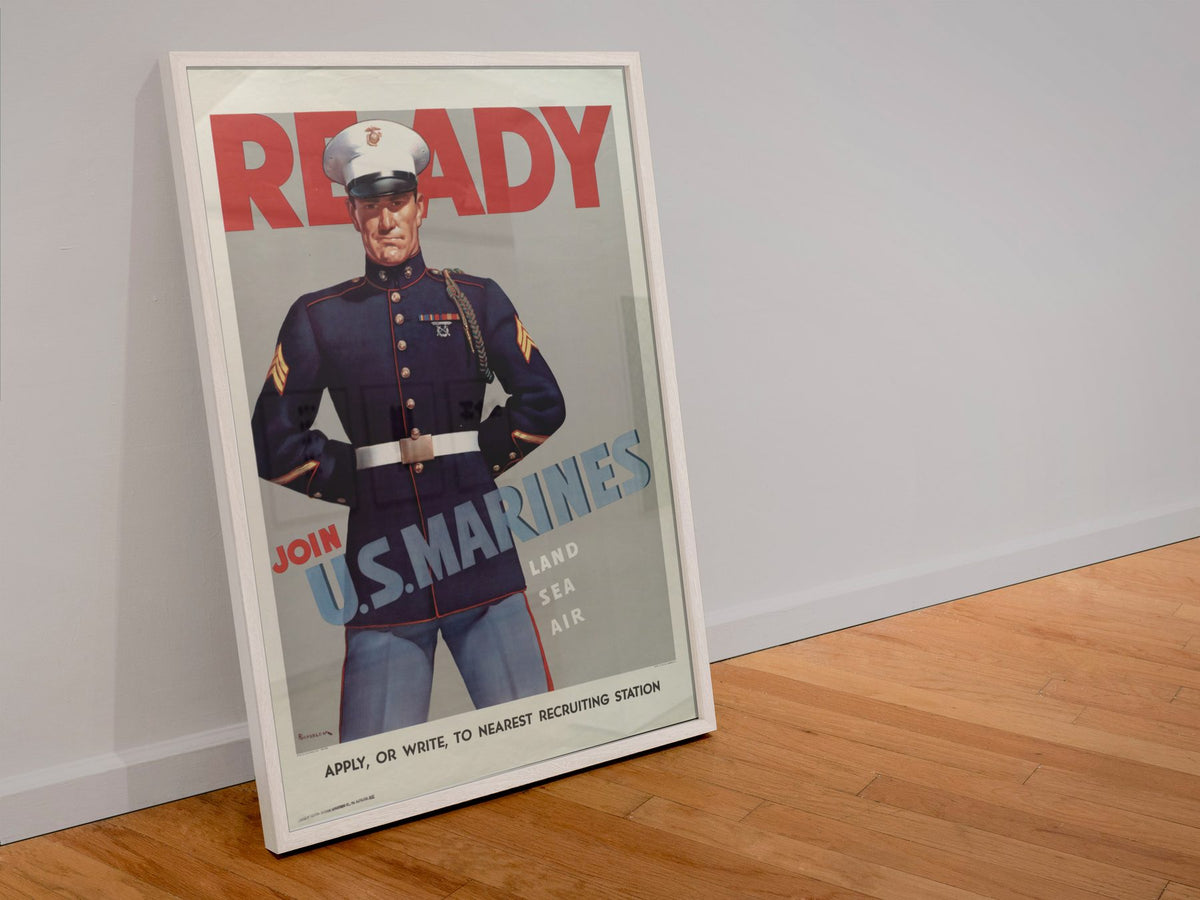 Ready Join US Marines poster in a white frame leaning against a wall