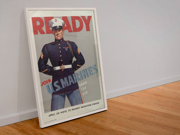 Ready Join US Marines poster in a white frame leaning against a wall