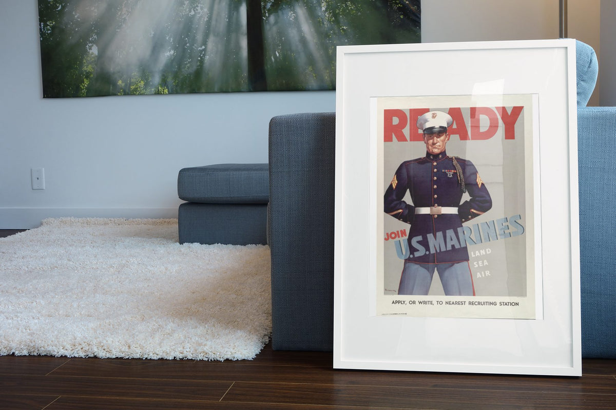 Ready Join US Marines poster leaning beside a blue sofa