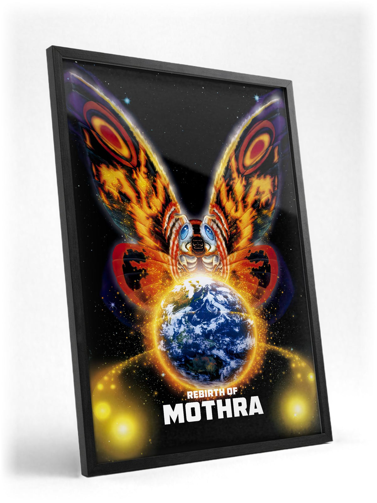 Rebirth of Mothra (1996) Movie Key Art poster in a black frame with glass leaning against a wall