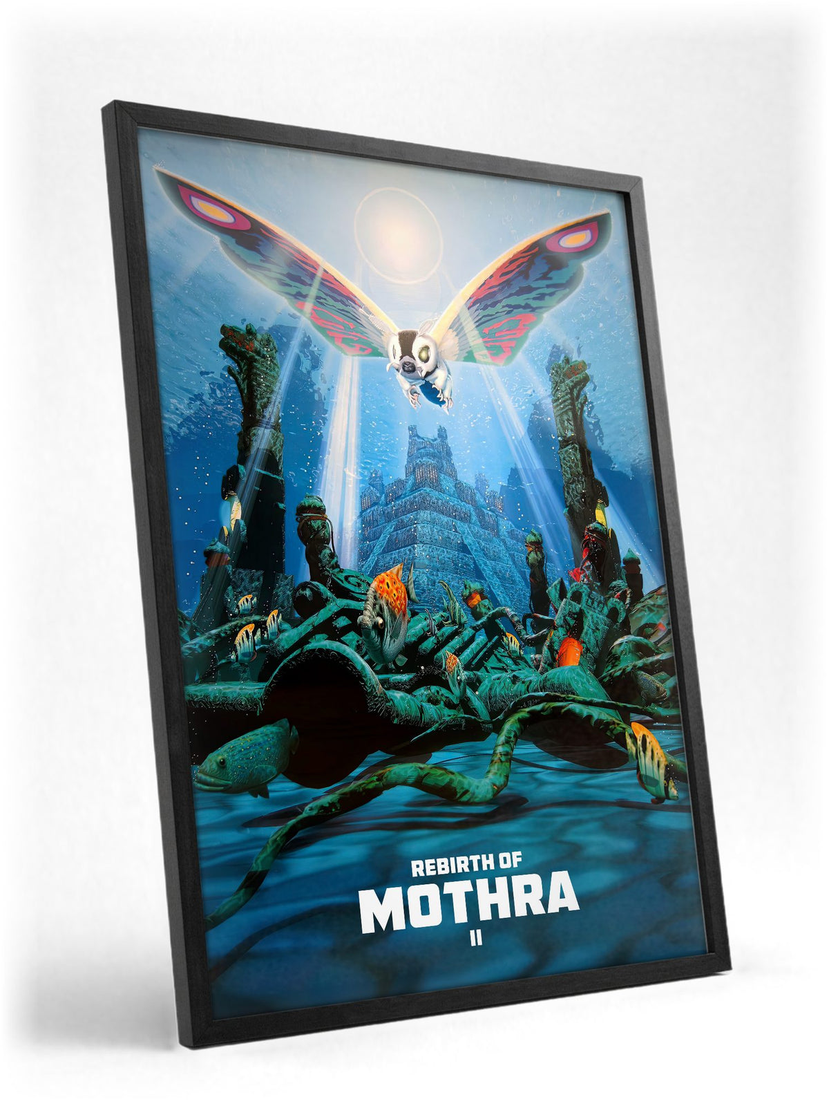 Rebirth of Mothra II (1997) Movie Key Art poster in a black frame with glass leaning against a wall