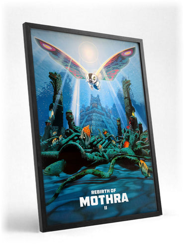 Rebirth of Mothra II (1997) Movie Key Art poster in a black frame with glass leaning against a wall