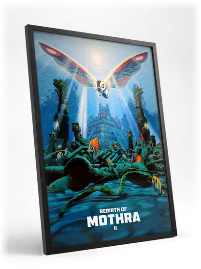 Rebirth of Mothra II (1997) Movie Key Art poster in a black frame with glass leaning against a wall