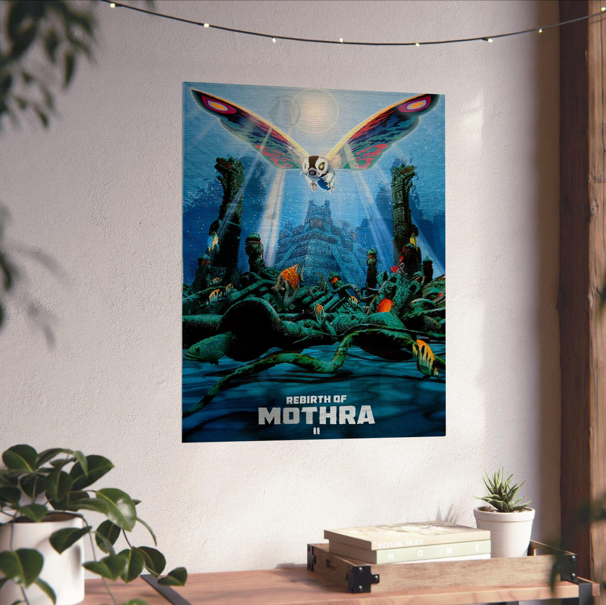 Rebirth of Mothra II (1997) Movie Key Art poster unframed on a white wall above a desk