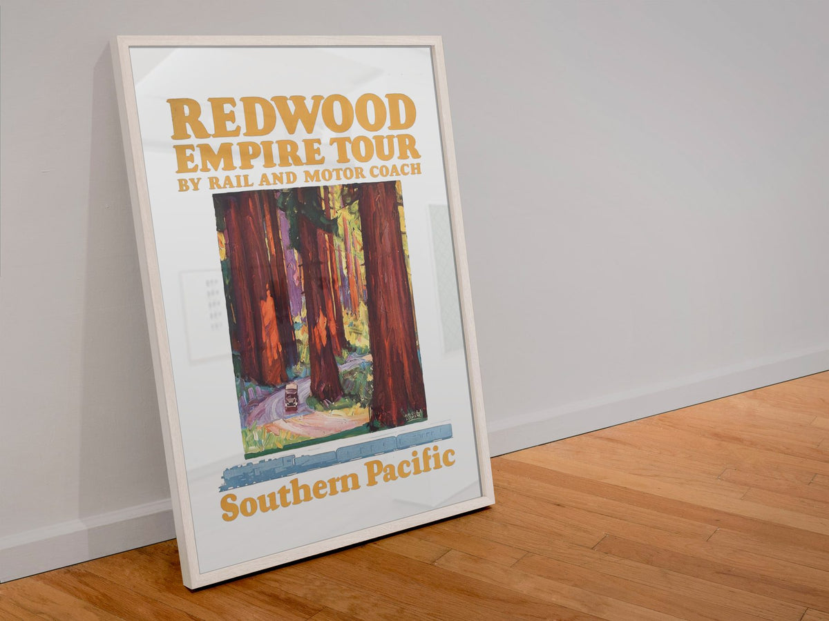 Redwood Empire Tour — Southern Pacific poster in a white frame leaning against a wall
