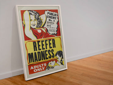 Reefer Madness Adults Only poster in a white frame leaning against a wall