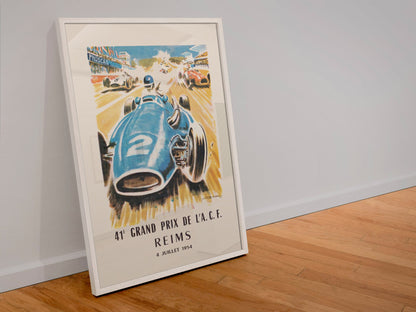 Grand Prix de l'ACF Reims 1954 poster in a white frame leaning against a wall