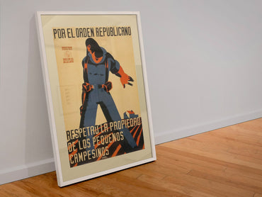 Respect the Small Farmer poster in a white frame leaning against a wall