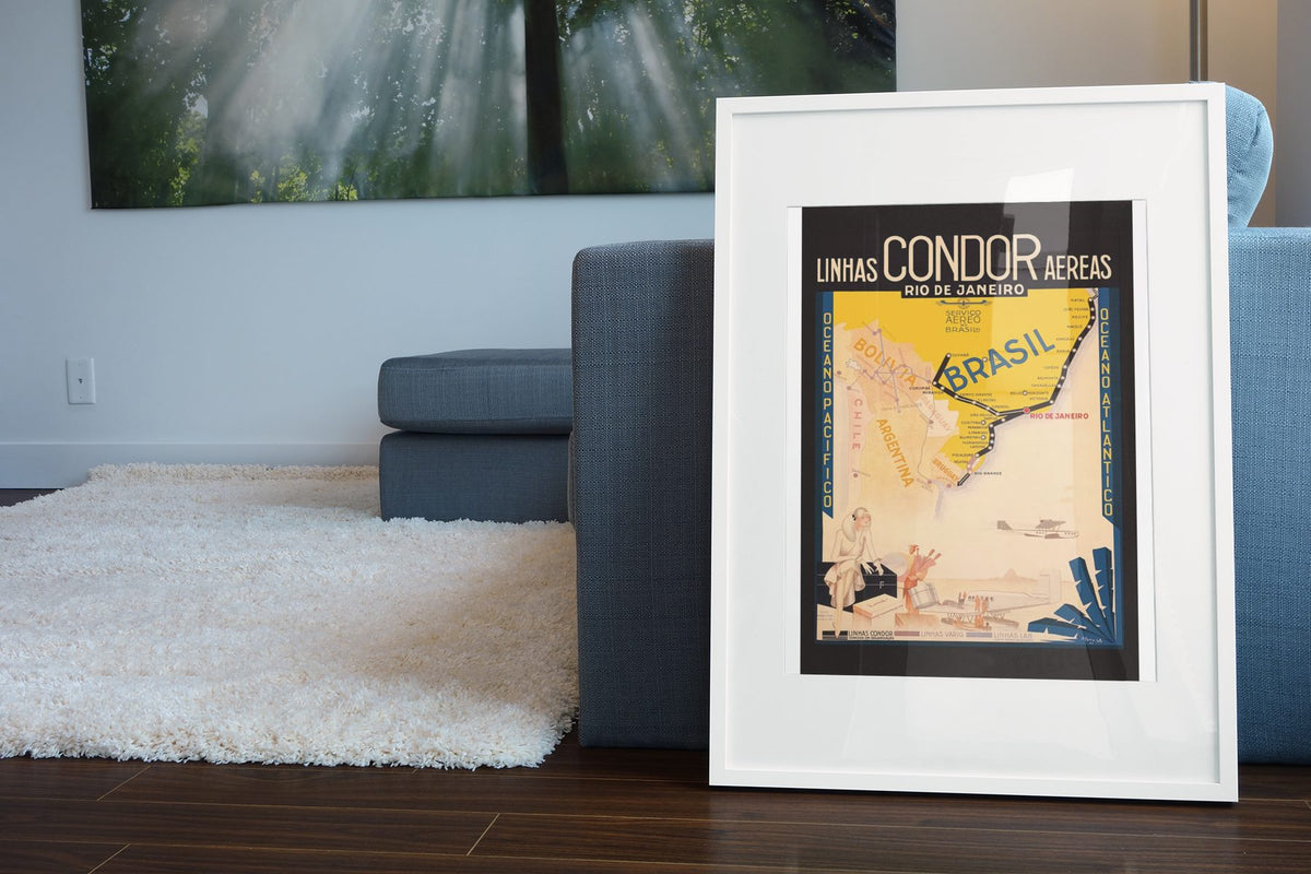 Rio de Janeiro Condor poster leaning beside a blue sofa