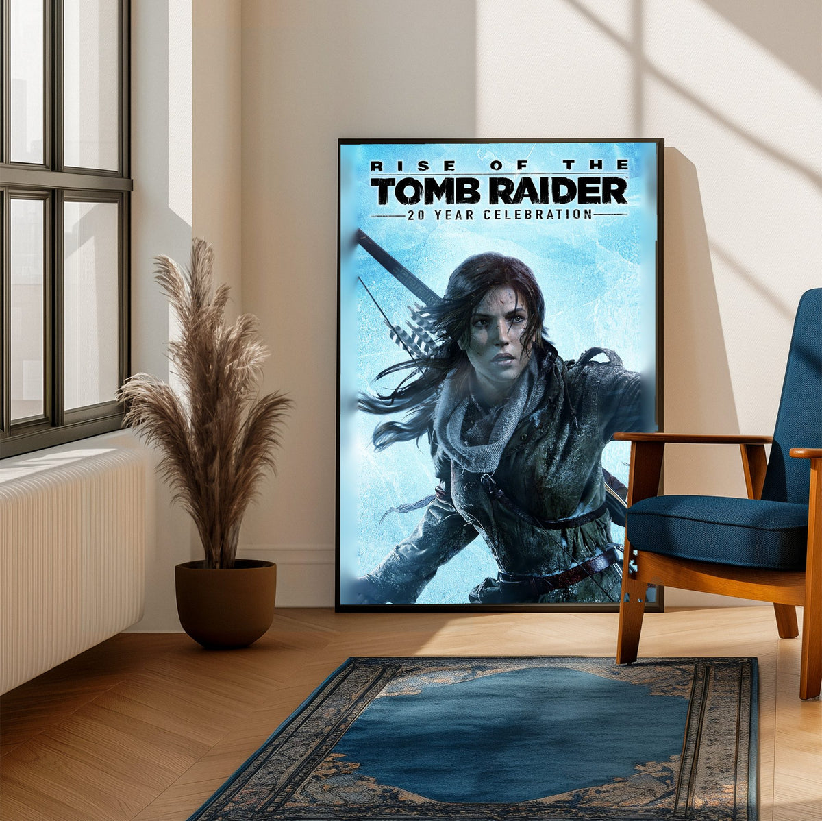 Rise of the Tomb Raider 20 Year Celebration Art poster framed beside a blue armchair in a sunlit room