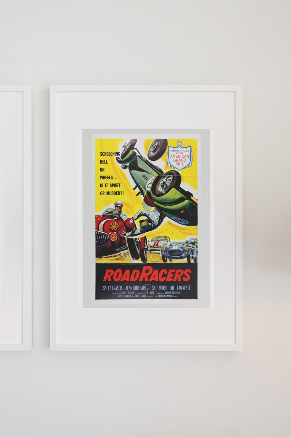 Road Racers 1959 poster in a white frame on a light wall