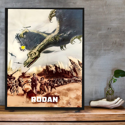 Rodan (1956) Movie Illustrated Art poster in a black frame on a wooden shelf against concrete