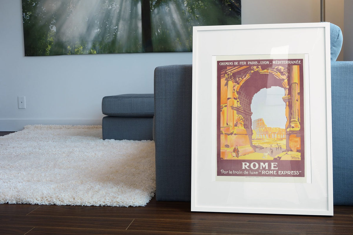 Rome — Arch of Titus poster leaning beside a blue sofa