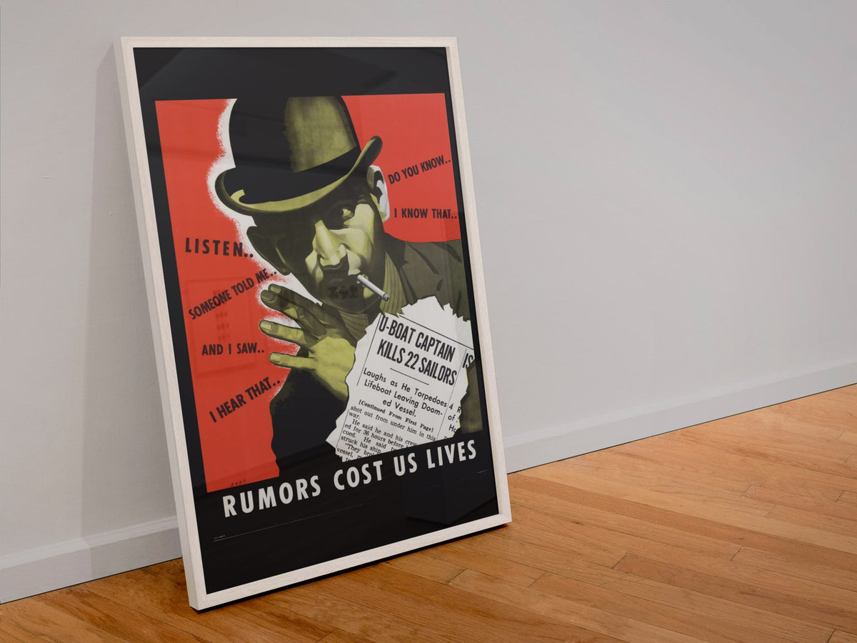 Rumors Cost Us Lives poster in a white frame leaning against a wall