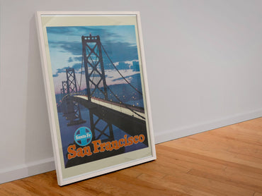 San Francisco Bay Bridge Santa Fe poster in a white frame leaning against a wall