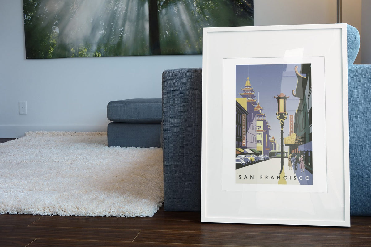 San Francisco Chinatown poster leaning beside a blue sofa
