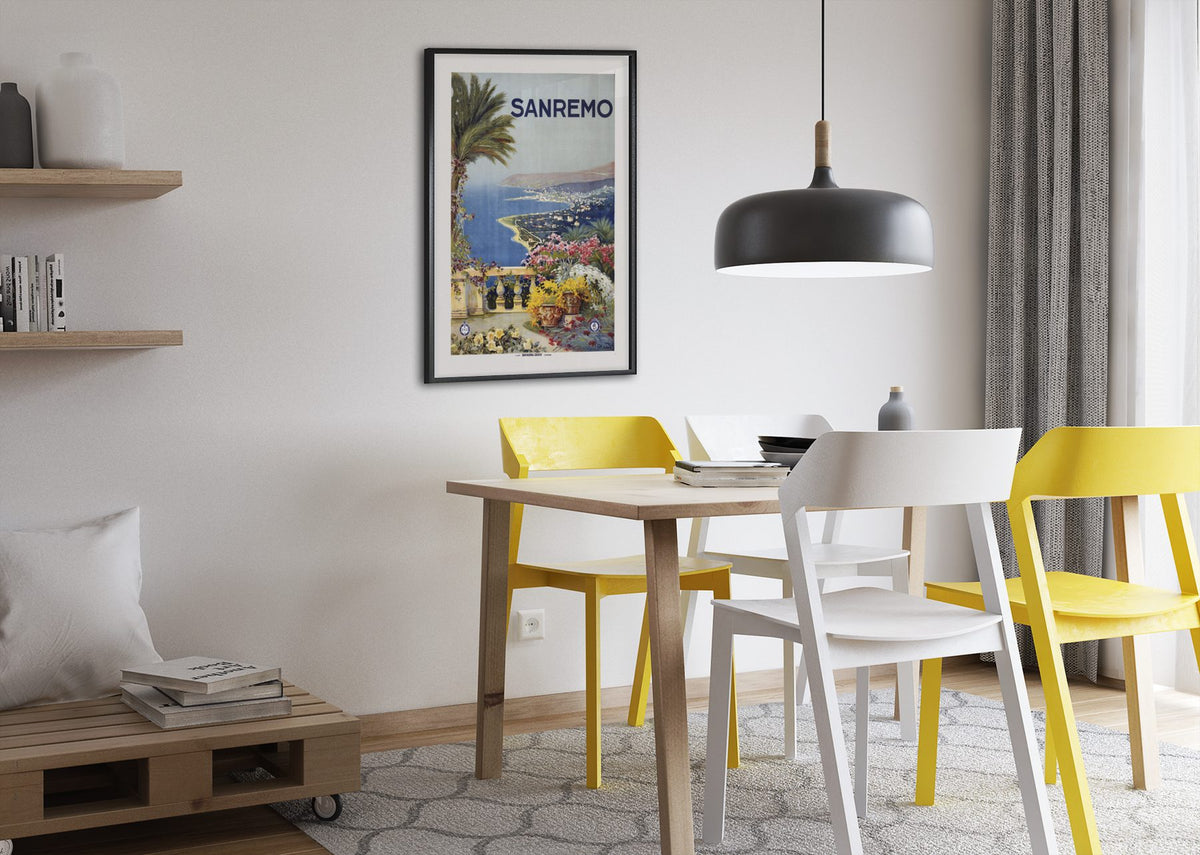 Sanremo — Italian Riviera poster framed above a dining table