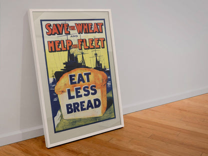 Save the Wheat Help the Fleet Eat Less Bread poster in a white frame leaning against a wall